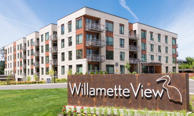 exterior shot of north point homes with Willamette View sign in the foreground